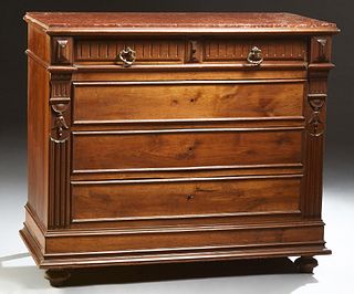 French Carved Walnut Marble Top Commode, 19th c., the inset highly figured rouge marble over two frieze drawers above three deep dra...