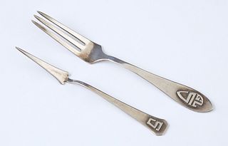 Two Newcomb College Silver Pieces, early 20th c., consisting of a berry fork, the handle with applied initials "GLS," and a nut pick...