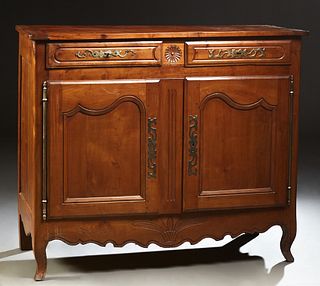 French Provincial Carved Cherry Louis XV Style Sideboard, 19th c., the rounded corner top over two frieze drawers, above double cupb...