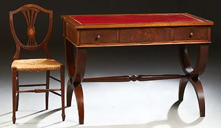 English Style Carved Mahogany Desk, early 20th c., the gilt tooled red leather inset top over three frieze drawers, with pullout lik...