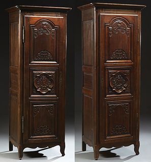 Matched Pair of French Provincial Louis XV Style Carved Walnut Bonnetieres, late 19th c., the stepped rounded corner crown over trip...