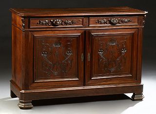 French Provincial Henri II Style Carved Walnut Sideboard, 19th c., the canted corner rounded edge top over two frieze drawers over d...