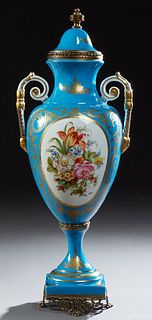 French Sevres Style Brass Mounted Covered Porcelain Handled Vase, 20th c., in Bleu d'Celeste with gilt decoration, and a painted flo...