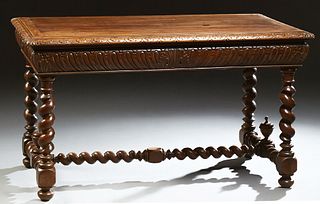 French Louis XIII Style Carved Walnut Writing Table, 19th c., the carved edge top over a sloping indented carved skirt, on rope twis...