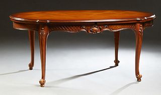 French Carved Cherry Louis XV Style Draw Leaf Dining Table, 20th c., the tortoise shaped parquetry inlaid top over a wide carved ski...