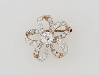 18K Yellow Gold Brooch/Pendant, early 20th c., with a central 1.25 ct. round diamond, atop five in-and-out graduated diamond mounted...