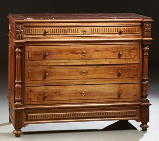 French Carved Walnut Marble Top Commode, 19th c., the inset highly figured rouge marble over a set back frieze drawer and three set...