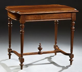 French Louis XV Style Carved Walnut Writing Table, early 20th c., the stepped serpentine top over a frieze drawer on turned tapered...