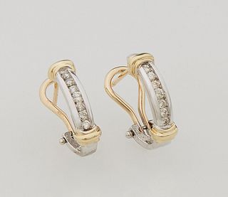 Pair of 14K White & Yellow Gold Half Hoop Earrings, each with seven 3 point diamonds, with omega clasps, total diamond weight-