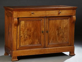 French Provincial Louis Philippe Carved Walnut Sideboard, c. 1860, the rectangular rounded edge top over two frieze drawers and two...