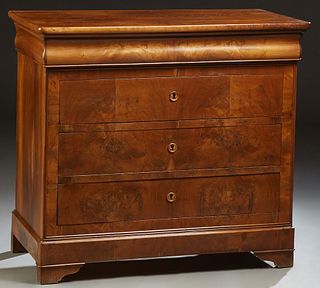 French Louis Philippe Carved Walnut Commode, c. 1860, the rounded corner top over a cavetto frieze drawer above three deep drawers,...