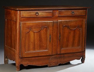 French Provincial Louis XV Style Carved Walnut Sideboard, 19th c., the three plank top above two frieze drawers over two cupboard do...