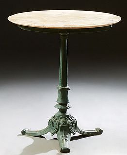 French Wrought Iron Marble Top Bistro Table, 19th c., the replaced circular creme marble over a wide skirt, on a tapered reeded supp...