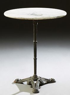 French Marble Top Wrought Iron Bistro Table, late 19th c., the circular figured white marble on a reeded support to pierced tripodal...