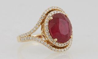 Lady's 14K Yellow Gold Dinner Ring with a 4.67 carat oval ruby a top a border of round diamonds, within a pierced split frame, also...