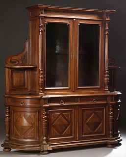 Exceptional Henri II Craved Walnut Buffet a Deux Corps, c. 1880, the stepped breakfront crown over setback double glazed doors flank...