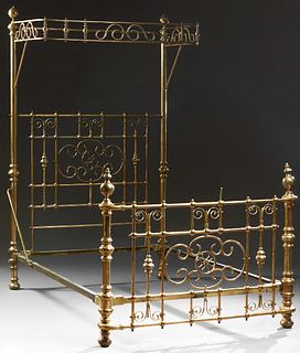 English Brass Half Tester Double Bed, early 20th c., the scroll decorated canopy on circular posts with turned finials, joined by a...