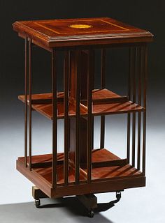 English Inlaid Mahogany Revolving Bookmill, 20th c., with reeded slatted sides, on four block legs on casters, H.- 31 1/2 in., W.- 1...