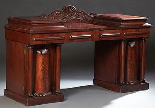 American William IV Carved Mahogany Double Pedestal Sideboard, 20th c., with a central drop well with a shell, scroll, and leaf carv...