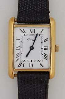 Lady's 18K Yellow Gold Electroplated Cartier Tank Wrist Watch, lacking the sapphire bezel, with a leather band, running. Provenance:...