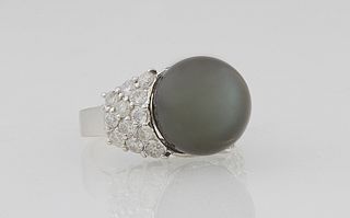 Lady's 14K White Gold Dinner Ring, with a 14mm black cultured Tahitian pearl, flanked by tapering shoulders of the band, each with t...