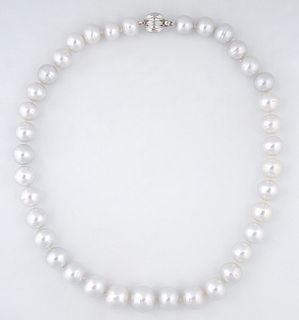 Graduated Strand of Thirty Seven Tahitian White Cultured Pearls, ranging from 11-14 mm, with a 14K white gold ball clasp, L.- 18.5 i...