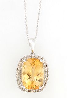 14K White Gold Pendant, with an oval cushion cut approximately 8 carat citrine, atop a border of tiny round citrines, on a 14K twist...