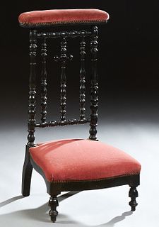 French Carved Ebonized Beech Prie Dieu, 19th c., the curved armrest over a cruciform turned and tapered back splat, above a serpenti...