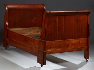 French Directoire Style Carved Beech Daybed, 19th c., the peaked sleigh ends on turned tapered reeded supports with turned finials o...