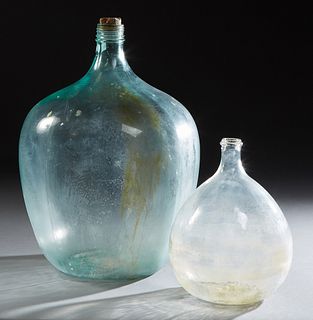 Two French Mold Blown Pale Green Glass Carboys, 19th c., Largest- H.- 24 in., Dia.- 18 in.