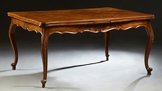 French Louis XV Style Carved Mahogany Draw Leaf Table, 20th c., the stepped edge serpentine parquetry inlaid top over a wide serpent...