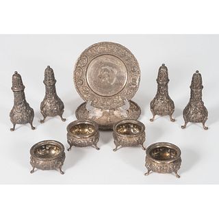 A Group of Loring Andrews Repoussé Castle Pattern Shakers, Salts and Plates