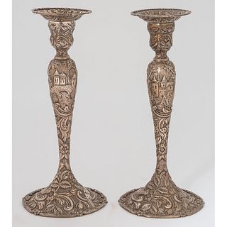 A Pair of Loring Andrews Repoussé Castle Pattern Silver Candlesticks