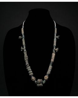 BRONZE AGE NECKLACE WITH AMULETS