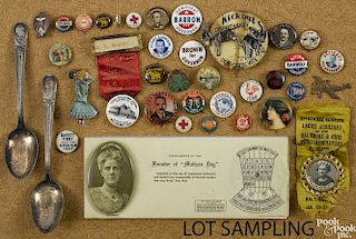 Group of political buttons, pins and advertising items.