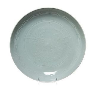 * A Celadon Glazed Porcelain Shallow Dish Diameter 11 inches.