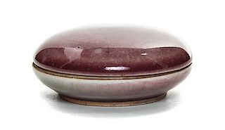 A Peach Bloom Glazed Porcelain Seal Paste Box and Cover Diameter 3 1/4 inches.