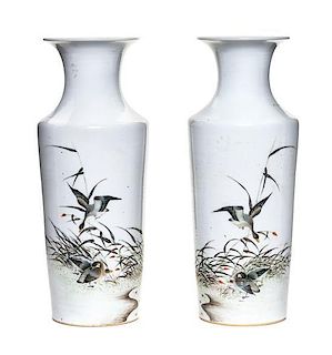 A Pair of Polychrome Enameled Porcelain Vases Height of pair 10 1/2 inches.