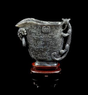 * A Large Carved Jade Libation Cup Height of jade 8 5/8 inches.