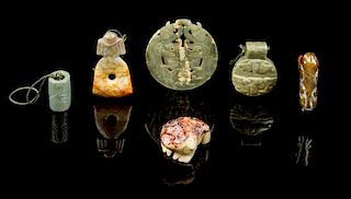 * A Group of Six Jade Carvings Diameter of largest 3 1/4 inches.