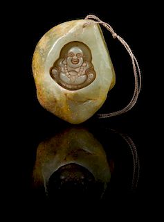 * A Carved Jade Pebble Length 2 3/8 inches.