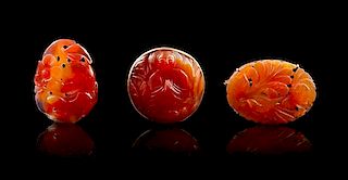 * A Group of Three Carved Carnelian Articles Height of largest 2 inches.