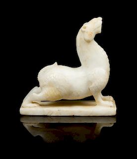 * A Carved Hardstone Figure of a Mythical Beast Width of base 5 inches.