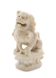 * A Carved Marble Figure of a Fu Lion Height 5 1/4 x width 3 inches.
