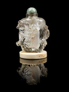 * A Carved Rock Crystal Snuff Bottle Height 2 3/4 inches.