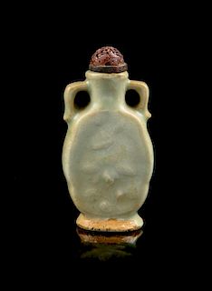 * A Celadon Glazed Porcelain Snuff Bottle Height 3 1/8 inches.