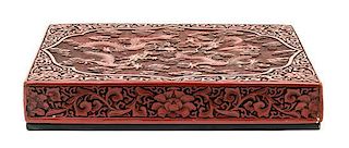 A Cinnabar Lacquered Box and Cover Height 2 1/2 x width 15 x depth 11 inches.