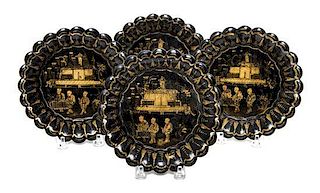 Four Gilt and Black Lacquer Dishes Diameter of each 6 3/8 inches.