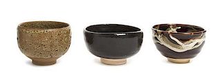 * Three Japanese Pottery Bowls Height of largest 3 1/2 x diameter 4 3/4 inches.