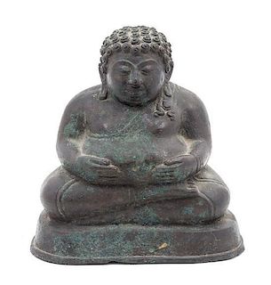 * A Bronze Figure of a Seated Buddha Height 6 1/2 x width 6 inches.